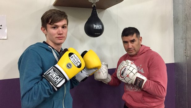 Yass teenager Adriaan Roodt, left, with boxing coach Spider. Adriaan, a student at Campbell High, was tragically killed in an accident on Mount Ainslie.