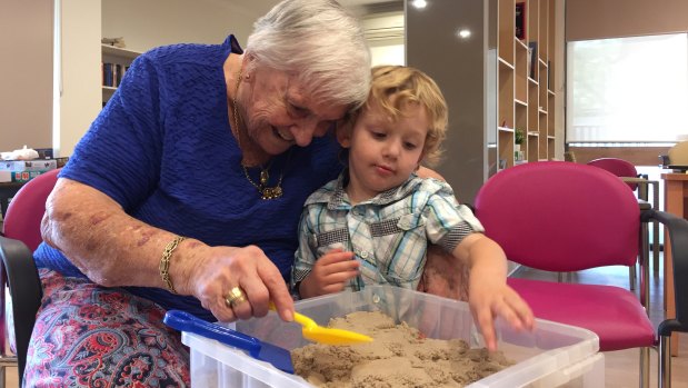 Judy Baker with Archie Tunningley, 3, at the Intergenerational Playgroup program in Weston.
