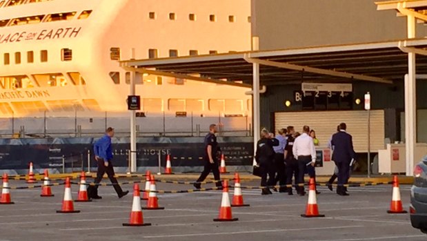 Investigators enter the cruise ship terminal at Hamilton on Sunday.