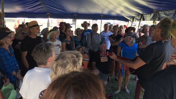 Stop Adani members create a singing circle while waiting for the formal event to start.