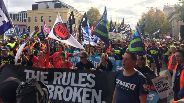 Workers carried banners and flags from dozens of unions.