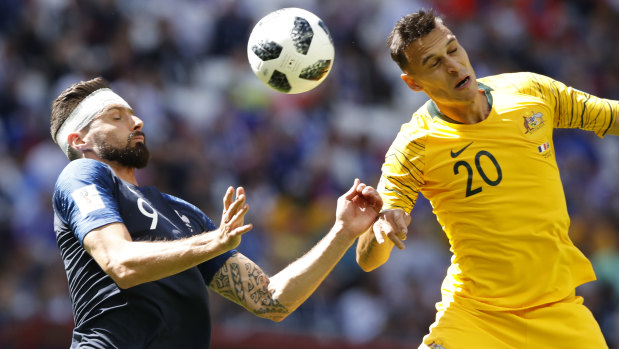 France's Olivier Giroud vies for the ball with Australia's Trent Sainsbury.