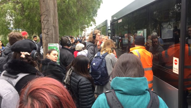 Commuters were piling onto packed buses at Clifton Hill on Tuesday.