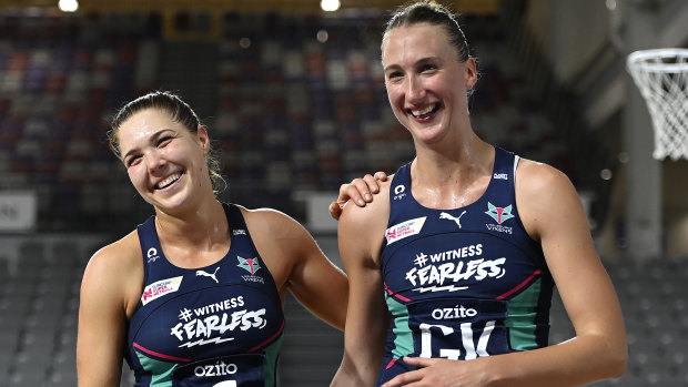 Vixens Kate Moloney and Emily Mannix celebrate their win over the Adelaide Thunderbirds.