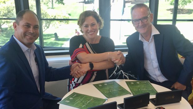 (From left) Cameron Costello of the Quandamooka people, Deputy Premier Jackie Trad and Tom Cutbush from Sibelco announce a "five-to-six year" rehabilitation program of the three sand mines on North Stradbroke Island, funded by Sibelco.