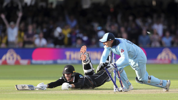 Jos Buttler runs out New Zealand’s Martin Guptill in the World Cup final four years ago.