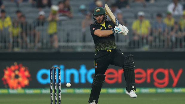 Half-ton: Aaron Finch hits out for Australia.