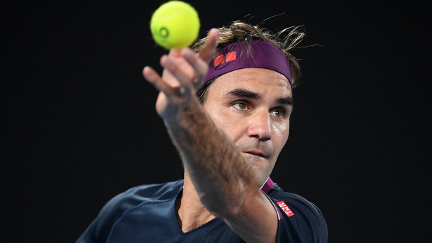 Roger Federer serves during his second round match against Filip Krajinovic of Serbia.