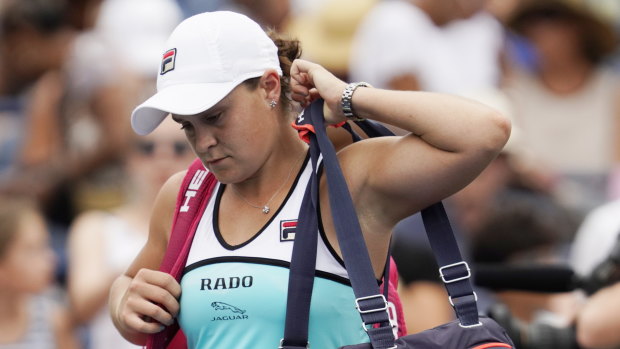 Ash Barty leaves the court after her upset loss.