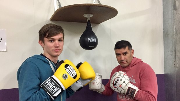 Yass teenager Adriaan Roodt, left, with boxing coach Spider. Adriaan, a student at Campbell High, was tragically killed in an accident on Mount Ainslie this week.