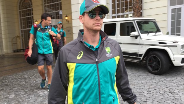 Eye of the storm: Steve Smith leaves his Cape Town hotel the morning after the ball-tampering scandal broke.