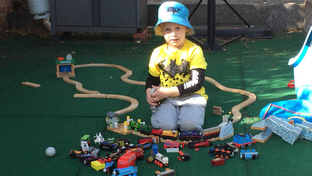 Blake Corney plays with his toy trains. The 4-year-old died at the scene of a multi-vehicle crash on the Monaro Highway near Mugga Lane on Saturday.