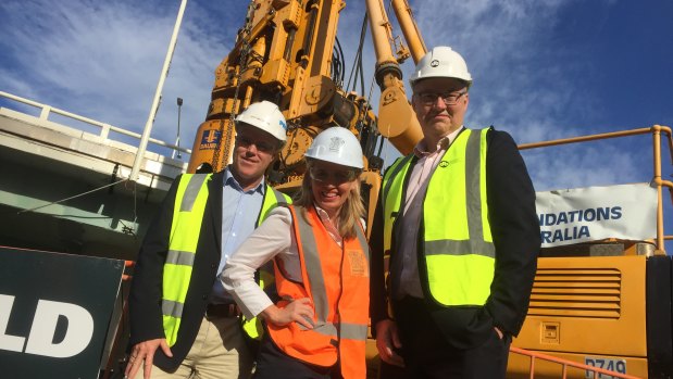 Work on the waterproof bund wall around Brisbane new casino begins, watched by ProBuild managing director Jeff Wellburn, Tourism Minister Kate Jones and project director Simon Crooks.