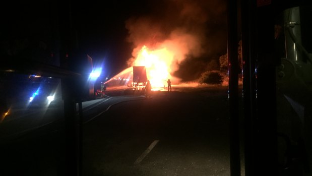 A 49-year-old truck driver escaped uninjured from a fire that engulfed a semi-trailer.