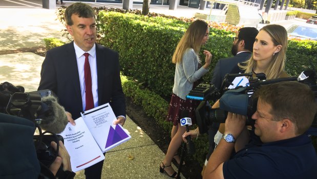 Science and Innovation Minister Dave Kelly with copies of two reports sent to the federal government arguing WA's case to host the headquarters of the Austrailan Space Agency. 