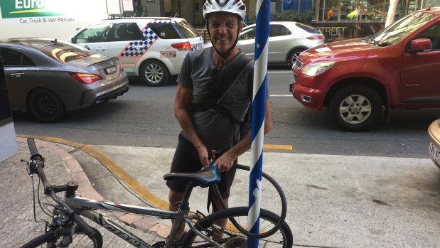 Brisbane cyclist Paul Harvey says potholes and old tram tracks are the biggest problem in a "relatively safe" CBD .