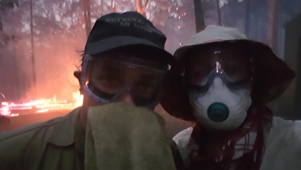 Ella Hungerford Shreaves and her husband Gabor outside her mother and Mr Muir's house after the fire front passed. 