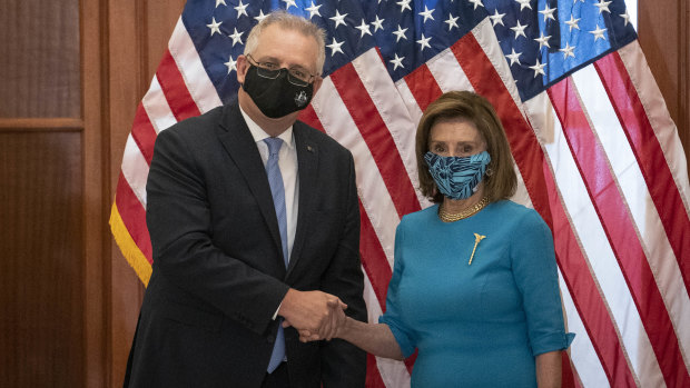 Australian Prime Minister Scott Morrison, left, shakes hands with US House Speaker Nancy Pelosi.