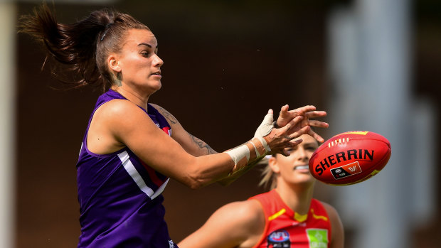 Gemma Houghton of the Dockers rises for a mark.