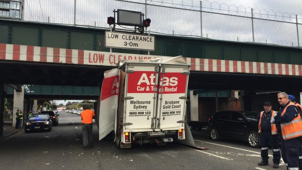 A truck trying, and failing, to pass under the bridge in 2017.