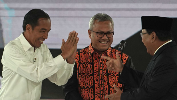 Joko Widodo, Indonesia's president, left, greets Prabowo Subianto, presidential candidate, right, on stage during a fourth presidential debate in Jakarta, Indonesia, on Saturday, March 30.