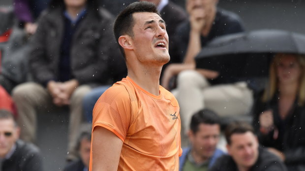 Bernard Tomic on his way to defeat in the first round at the French Open.