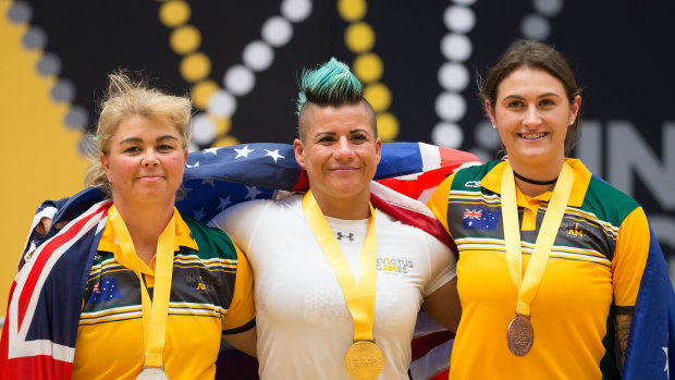 Powerlifting medalists left to right: silver medal Nikki Bradley from Australia, gold medal Sebastiana Lopez from USA, bronze medal Alexia Vlahos from Australia. 
