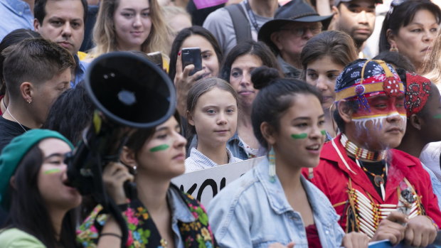 Swedish activist and student Greta Thunberg, centre, takes part in the Climate Strike in Montreal on September 27.