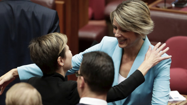 Kristina Keneally is congratulated by Senator Jenny McAllister after delivering her maiden speech in the Senate.