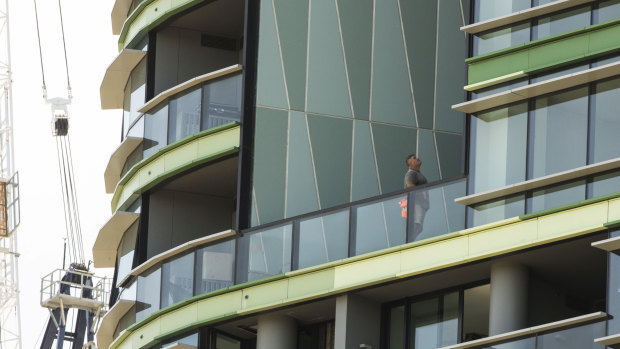 Tradesmen working on Opal Tower in Olympic Park.