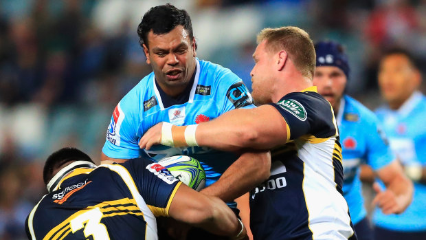 'Out-enthused': Kurtley Beale gets crunched in some aggressive Brumbies defence.