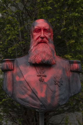 A bust of Belgium's King Leopold II is smeared with red paint and graffiti in Belgium.
