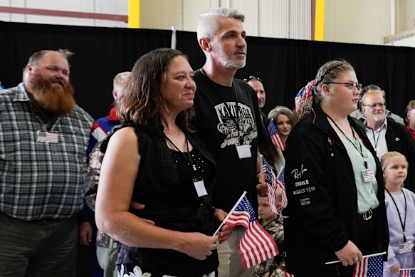 Many of the refugees held American flags that were given to them upon their arrival