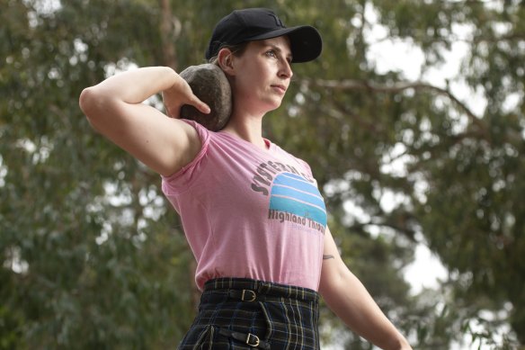 Helen Oakley with one of the rocks used in the stone put competition. 