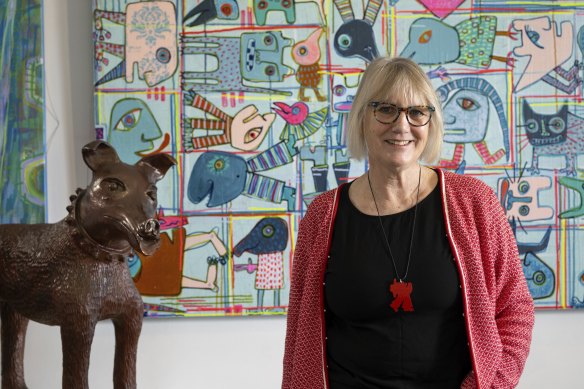 Artist Pamela Irving in her Bentleigh studio with her trusty dog, Larry La Trobe. 