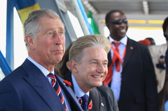 Prince Charles, left, shares a joke with Clive Alderton, his private secretary, on a ferry in Dar es Salaam, Tanzania, in 2011.