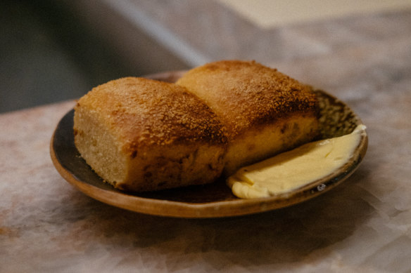 Pandesal bread with latik butter.