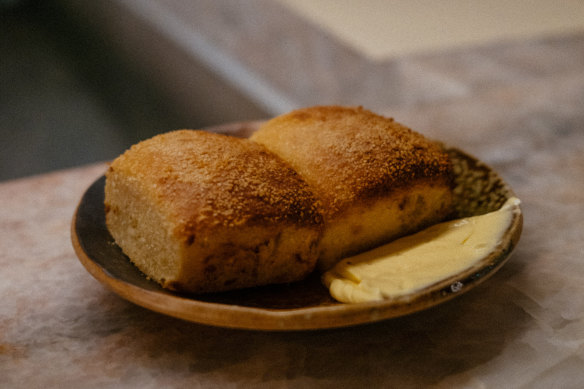 Pandesal bread with latik butter.