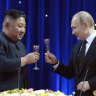 North Korean leader Kim Jong Un raises a toast with Russian President Vladimir Putin.