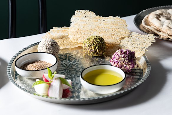 Lamb naye balls coated with sesame seeds, crushed pistachio and dried rose petals.