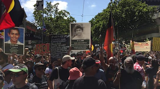 MOre than 10,000 Invasion Day protestors gathered on the steps of the Victorian Parliament before marching through central Melbourne. 