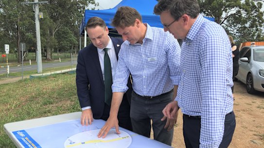 Brisbane lord mayor Adrian Schrinner, Bonner MP Ross Vasta and then-Cities Minister Alan Tudge talking over a $226 million “congestion-busting” package for south-east Queensland roads. 
