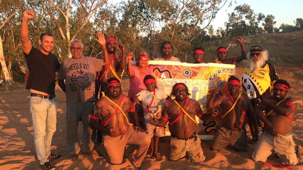 Thomas Mayor (far left) takes the Uluru Statement canvas to the Yule River Bush meeting in the Pilbara.