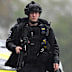 Armed police maintain road blocks and security checks around RAF Fairford.