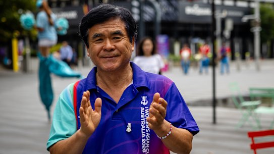 Joon Shik Shin watches as Su Hee Cho & Co, a traditional Korean percussionist group, performs during a celebration of the 2026 Women’s Asian Cup in Parramatta Square.