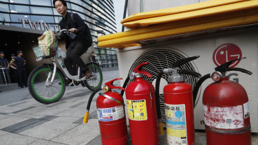 Fire extinguishers are placed near a building where the Japanese embassy is located in Seoul.