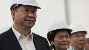In the early days, Xi Jinping and Carrie Lam visit a section of the Hong Kong-Zhuhai-Macau bridge in Hong Kong in 2017. 