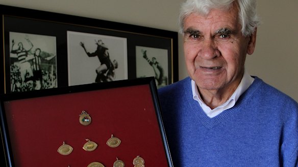 AFL great Graham 'Polly' Farmer at home in 2010 with his football medals. 