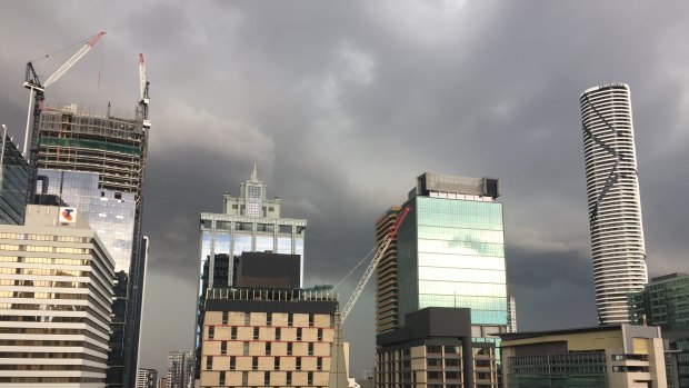 The severe storm rolls in above Brisbane City.