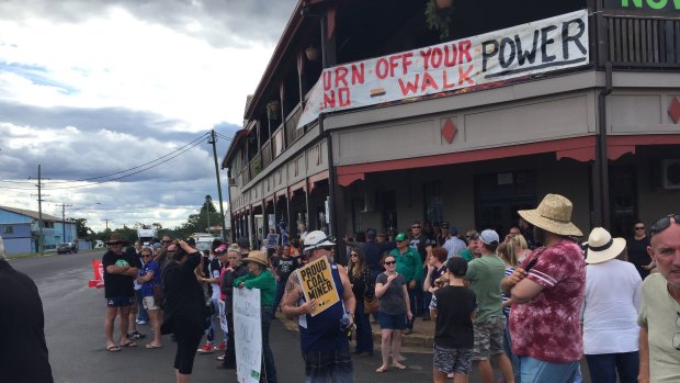Protestors move to line the main streets of Clermont as the Stop Adani convoy arrives on Saturday afternoon.